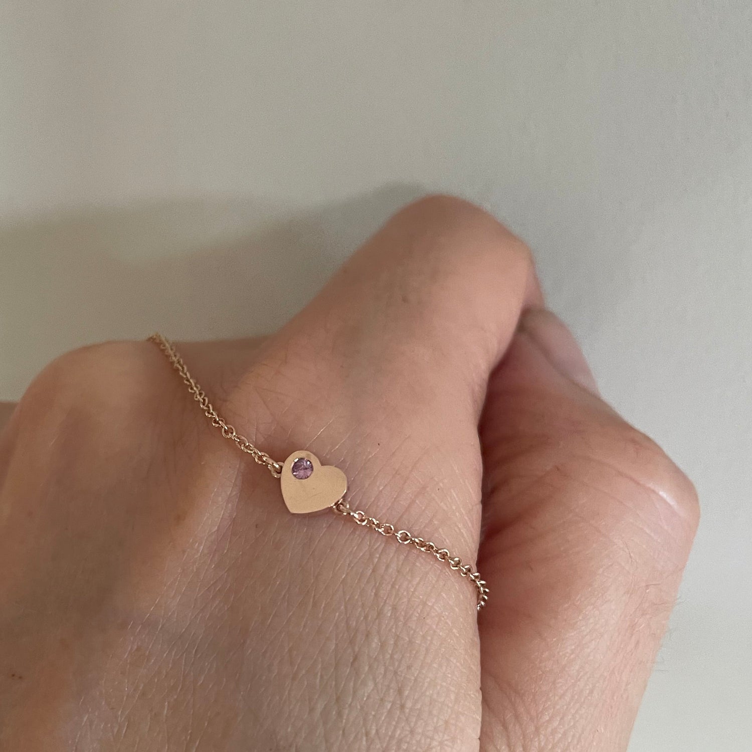 pink stone set gold heart bracelet 