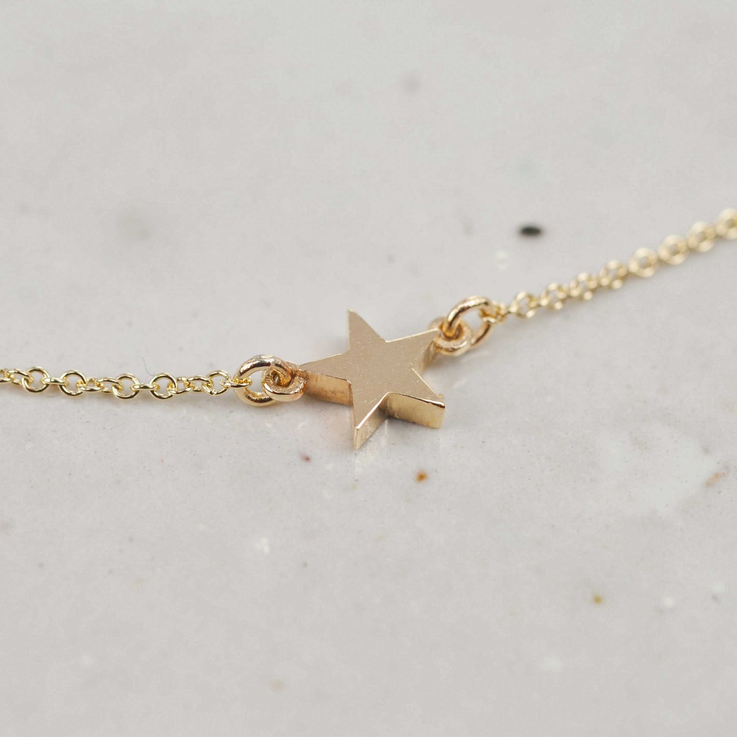 Solid recycled gold single star necklace on fine chain