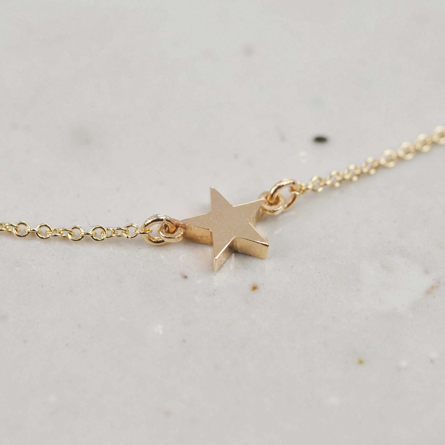 Solid recycled gold single star necklace on fine chain