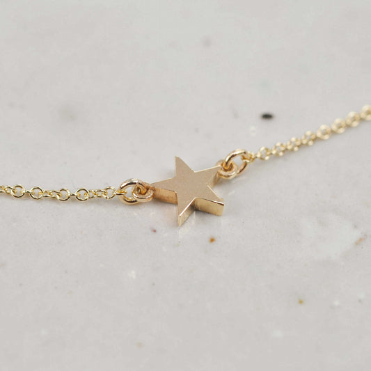 Solid recycled gold single star necklace on fine chain