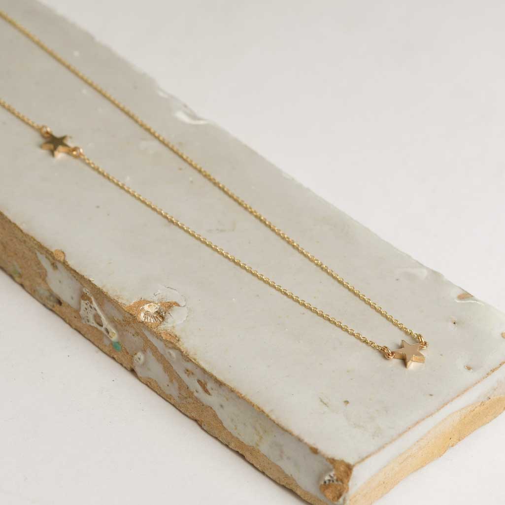 Layered delicate gold star necklace
